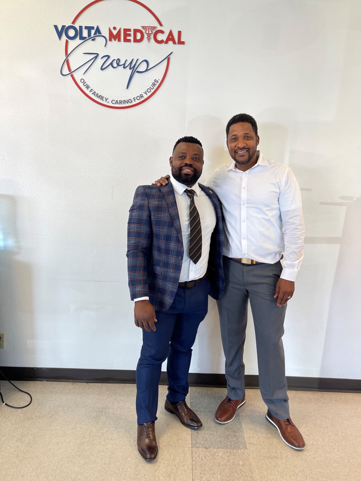 Two entrepreneurs standing inside Volta Medical Group