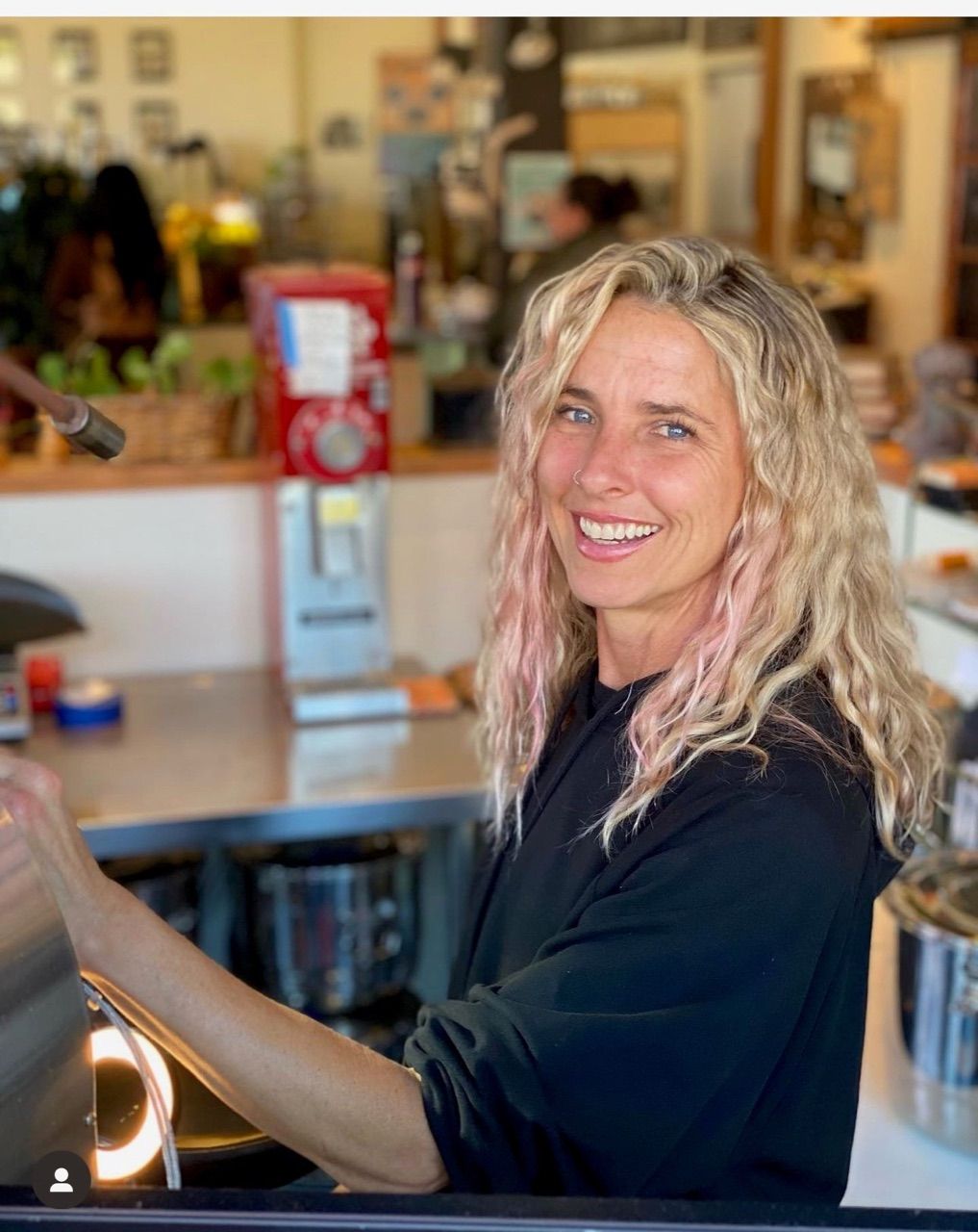 Amanda Morrow inside The Flower Pot Café